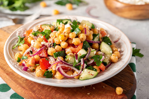 istock Chickpea salad in a plate on a served table 1213546169