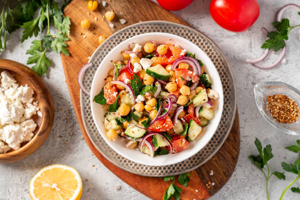 istock Chickpea salad on a gray background top view 1213546957