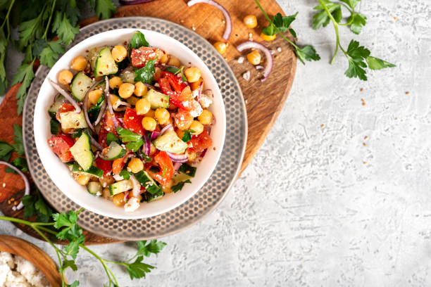 istock Chickpea salad on a gray background top view 1213547013