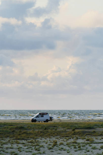 istock Camper  van  parked on seaside in Denmark 1213547346