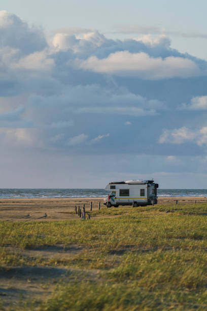 istock Camper  van  parked on seaside in Denmark 1213547402