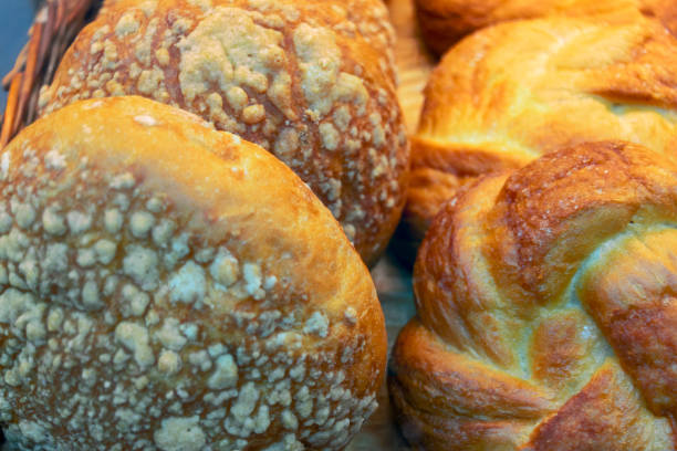 istock Fresh white bread on a supermarket counter. Closeup. 1213547580