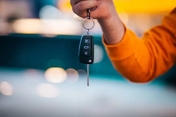 Photo of Man holding a car key