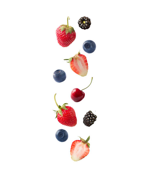 isolated fresh berries float in the air. falling blackberry, blueberry, cherry and strawberry fruits isolated on white background with clipping path. mixed berries with a copy space for text. - blackberry bush plant berry fruit imagens e fotografias de stock