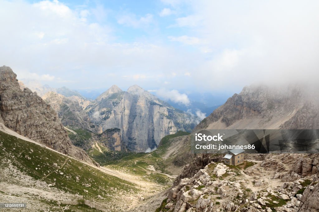 Alpine hut Rifugio Tosa and mountain alps panorama in Brenta Dolomites, Italy Adamello Brenta National Park Stock Photo