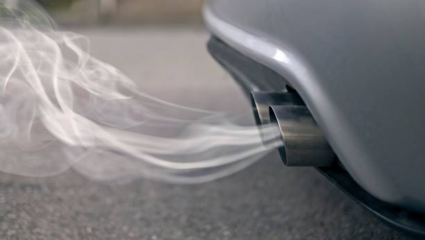 Smoky exhaust pipes from a starting diesel car. Smoky exhaust pipes from a starting diesel car. exhaust pipe photos stock pictures, royalty-free photos & images