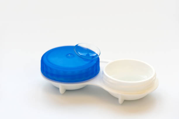 istock Contact lens on contact lens case on white background. Soft focus. Macro. Ophthalmology and health concept 1213551107