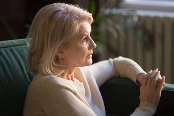 istock Pensive elderly woman look in distance thinking or mourning 1213552231