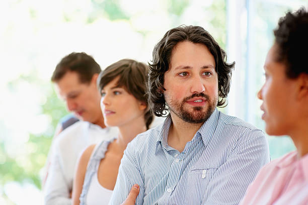 istock Man having a discussion with his colleague 121355366