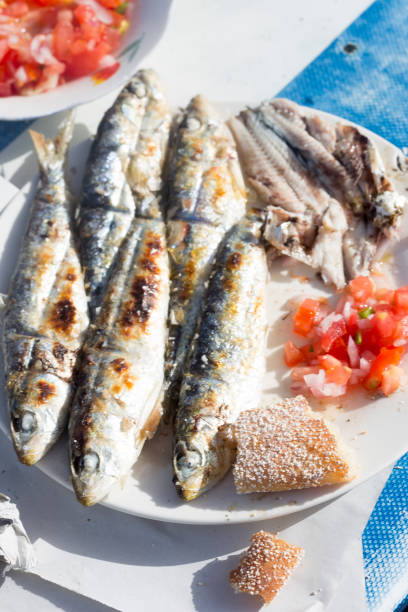 istock Grilled sardines with moroccan tomato salad 1213553846