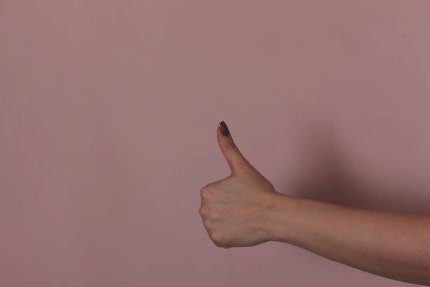 istock woman hand thumb 1213554215
