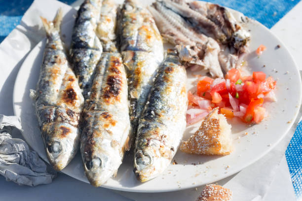 istock Grilled sardines with moroccan tomato salad 1213554239