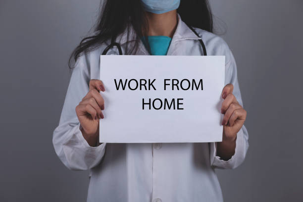 istock work from home  on paper doctor hand 1213554711