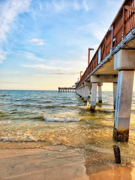 Pier at Fort Myers beach Sunset at Fort Myers Pier fort myers photos stock pictures, royalty-free photos & images