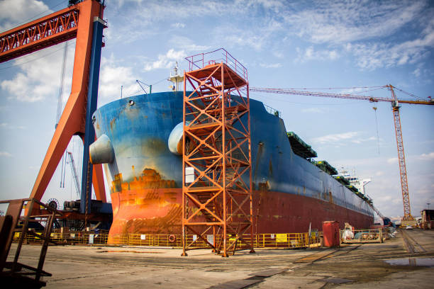 istock A large tanker cargo ship is being renovated and painted in shipyard dry dock 1213558300