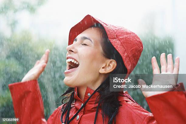 Joyful Woman Playing In Rain Stock Photo - Download Image Now - Rain, Women, One Woman Only