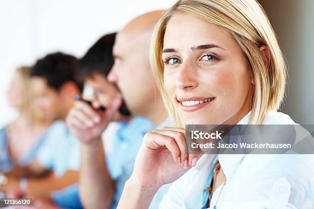 Happy Young Business Woman With Colleagues At A Conference Stock Photo - Download Image Now