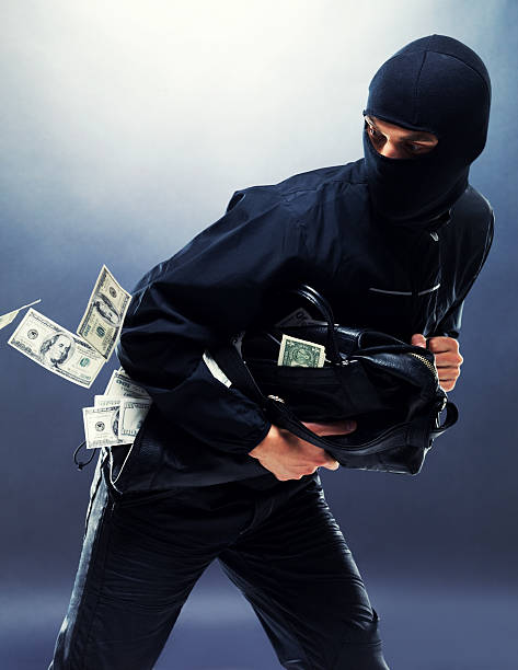 istock Bank robbery - Male thief running with handbag 121356139
