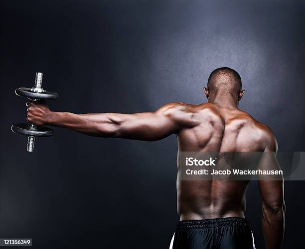 Young Male Lifting Dumbbell Stock Photo - Download Image Now - Men, African Ethnicity, African-American Ethnicity