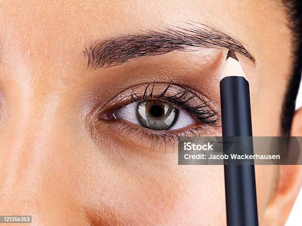 Attractive Woman Applying Eyebrow Pencil Stock Photo - Download Image Now - Eyebrow, Eyebrow Pencil, Pencil