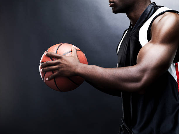 istock Young man playing basketball - Cropped 121356403