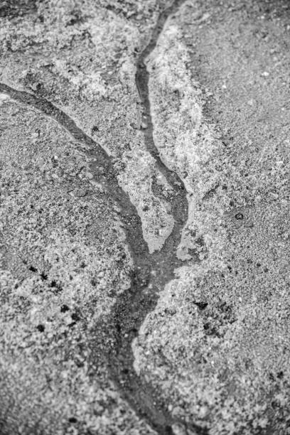 istock dirty stream of melted snow flows to the river 1213564813