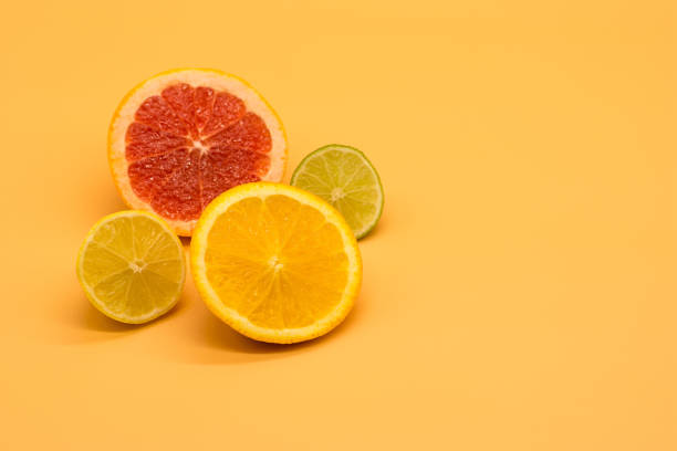 istock various citrus slices of orange lime lemon and grapefruit arranged on colorful background abstract wallpaper with copy space 1213566666