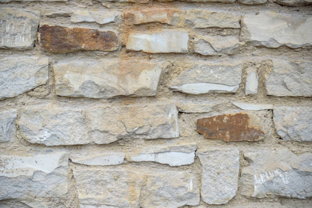 High resolution cream brick wall texture of ancient building.