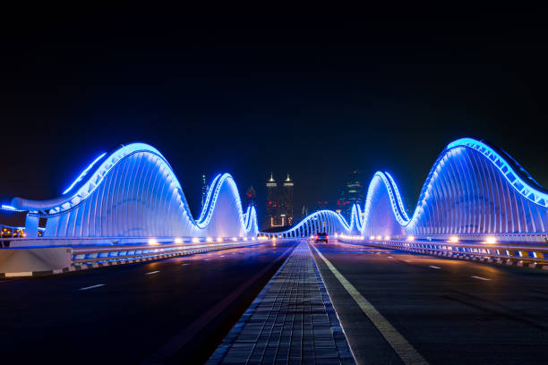 istock Meydan bridge in Dubai illuminated at night 1213570123