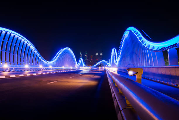 istock Meydan bridge in Dubai illuminated at night 1213570127