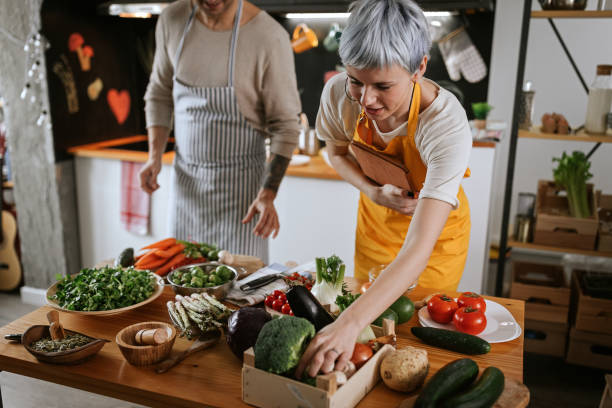 istock Young couple making healthy meal together at modern kitchen 1213571546