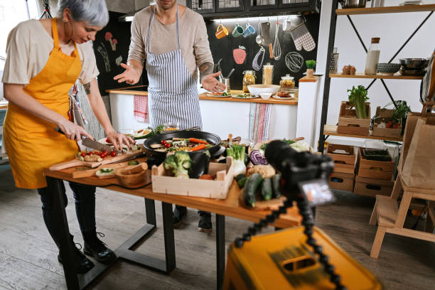 istock Young couple vlogging about vegetarian food 1213571571