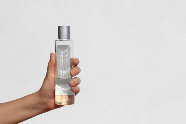 istock Hand with cologne isolated on white background 1213572198