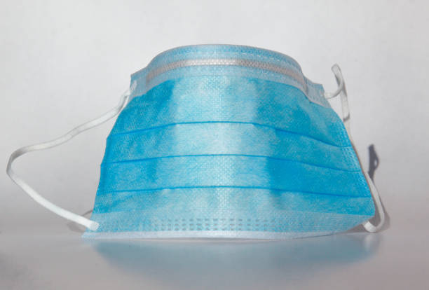 istock Isolated blue medical mask for virus protection 1213572231