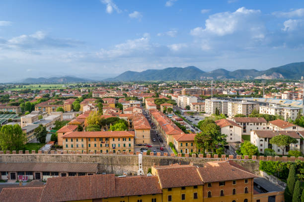 istock Pisa cityscape with fields and mountains at the background 1213572613