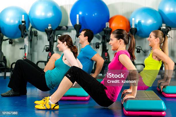 People In Gym On Step Board Stock Photo - Download Image Now - Activity, Adult, Adults Only