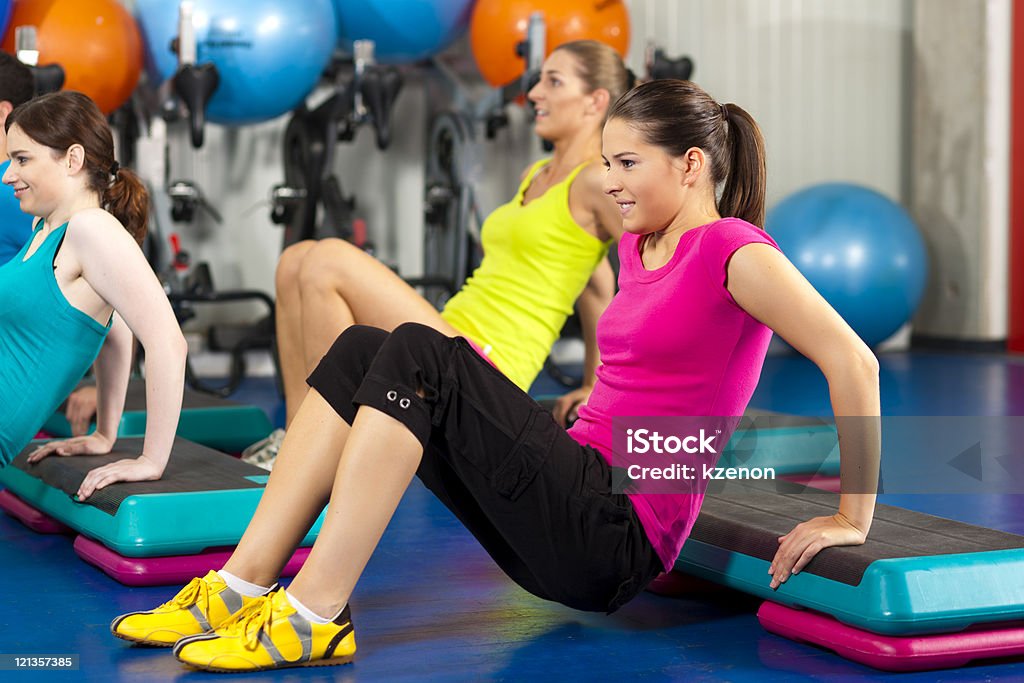 People in gym on step board  Activity Stock Photo