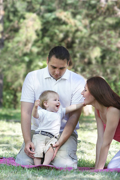 istock young happy family on natural background 121357548