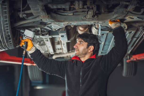 istock a man repairing a car 1213578108