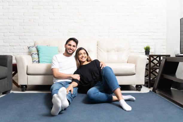 istock Happy Hispanic Couple Relaxing At Home 1213581600