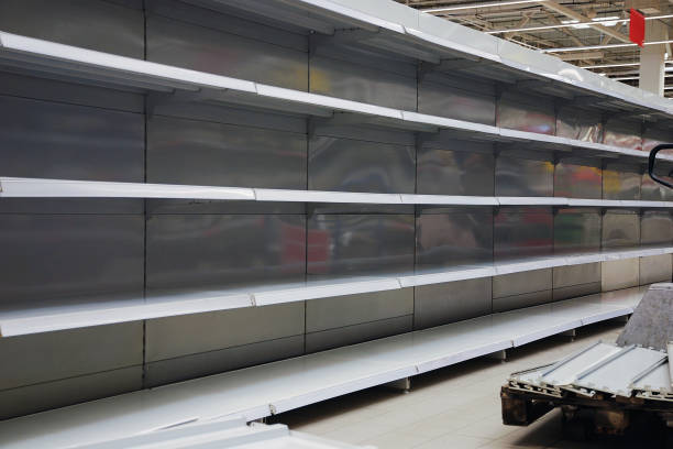 istock Empty shelves in large grosery store 1213581653
