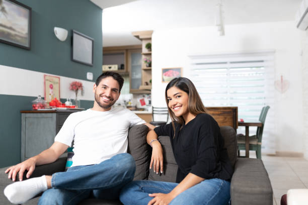 istock Happy Hispanic Couple Relaxing At Home 1213582662