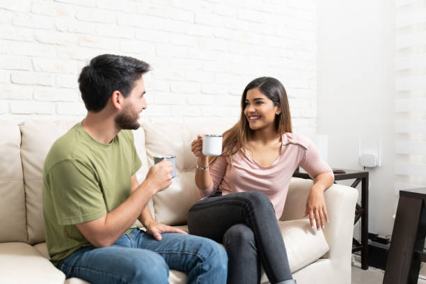istock Smiling Latin Couple Having Coffee At Home 1213582841