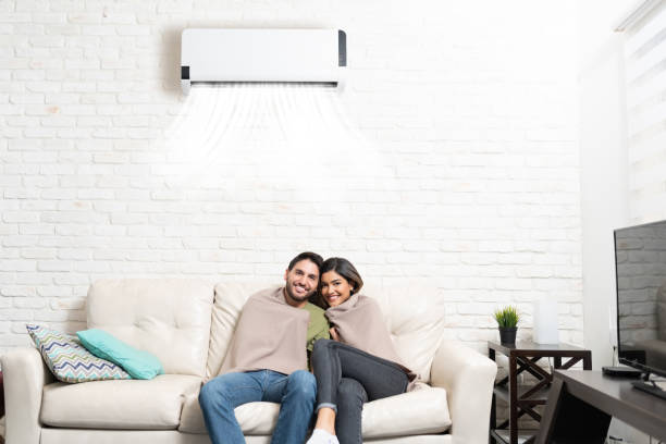 istock Couple Covered With Blanket Relaxing At Home 1213582912