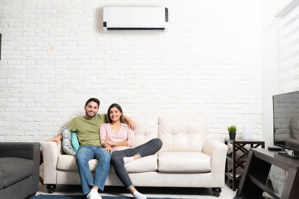 istock Happy Couple Sitting On Sofa At Home 1213583451