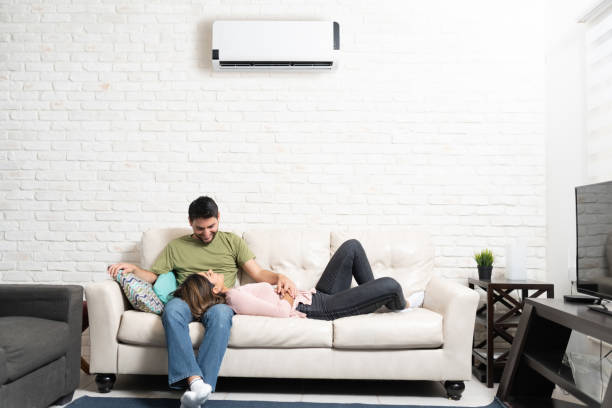 istock Smiling Latin Couple Relaxing At Home 1213583487