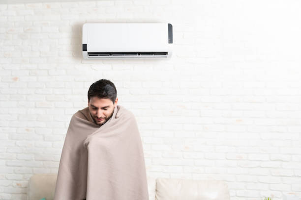 istock Man Covered With Blanket At Home 1213583615