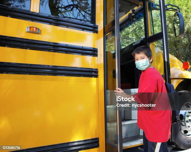 School Age Boy Wearing Surgical Mask Stock Photo - Download Image Now - School Bus, Protective Face Mask, Child