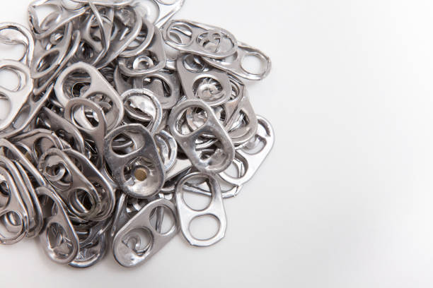istock aluminum seals from beer can on a white background, recyclable material 1213586722