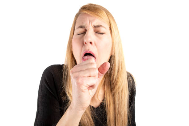 istock Woman Dry Coughing into Her Hand 1213587474